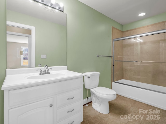 full bath with toilet, visible vents, vanity, combined bath / shower with glass door, and tile patterned floors