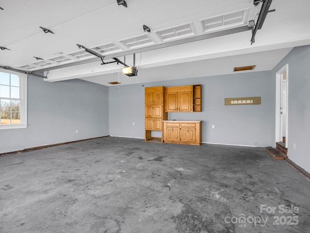 garage featuring a garage door opener