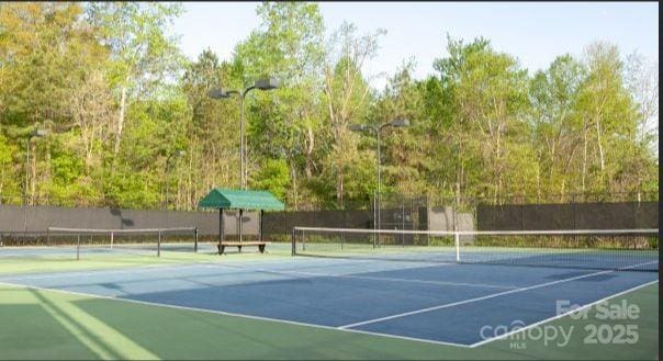 view of sport court with fence