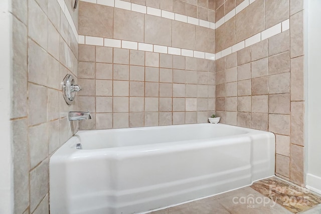 bathroom with a tub to relax in