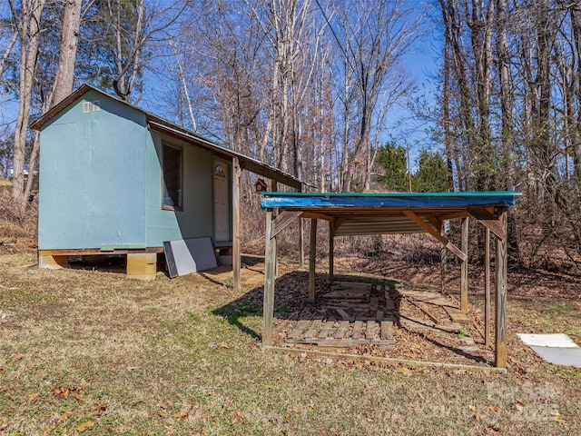 exterior space featuring an outbuilding and a detached carport