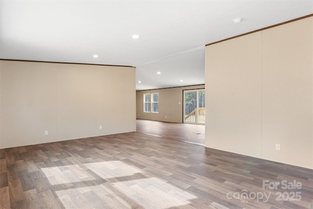 unfurnished room with crown molding, wood finished floors, and recessed lighting