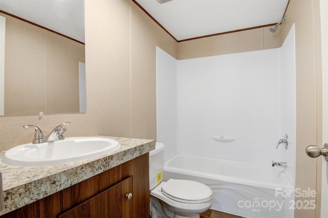 bathroom with ornamental molding, shower / bath combination, vanity, and toilet