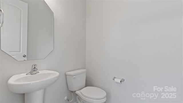 bathroom with a sink and toilet