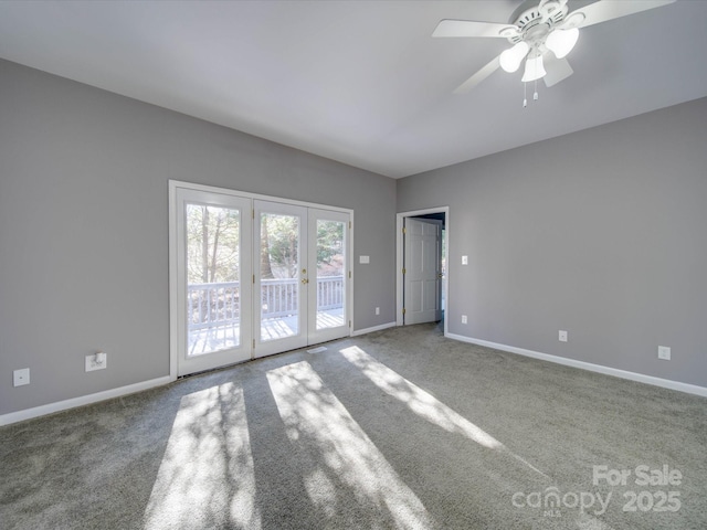 carpeted empty room with a ceiling fan and baseboards