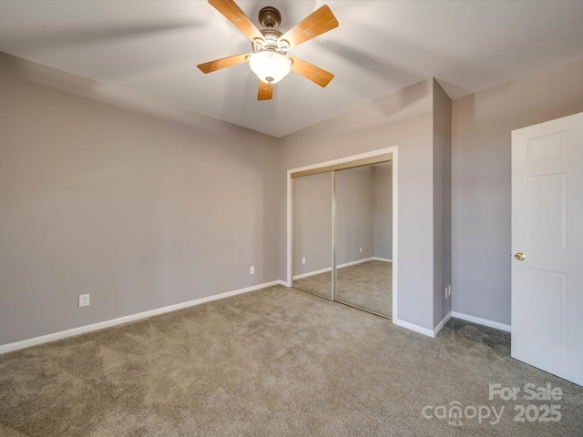 unfurnished bedroom featuring a closet, carpet flooring, a ceiling fan, and baseboards