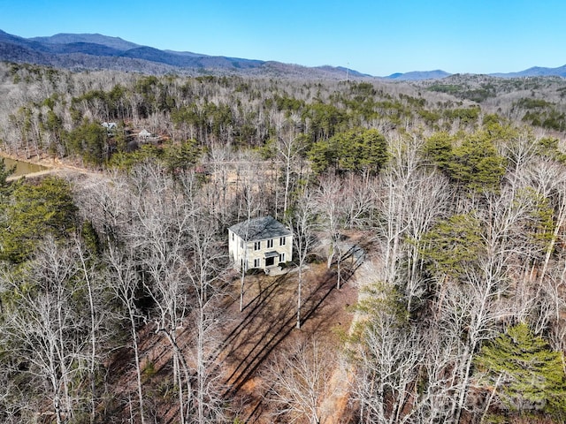 bird's eye view with a mountain view and a forest view