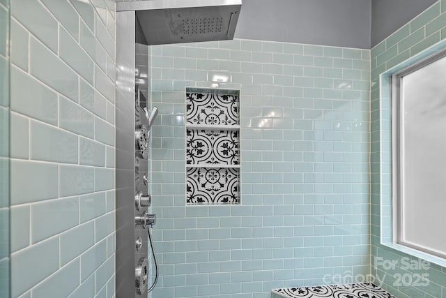 bathroom with tiled shower