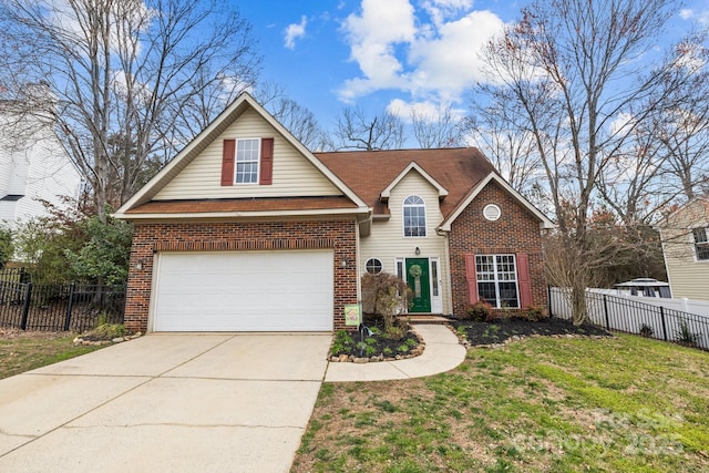 traditional-style house with a front yard, brick siding, driveway, and fence