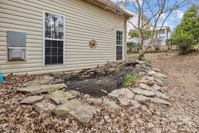 view of side of property with fence