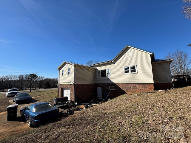 view of side of home with an attached garage