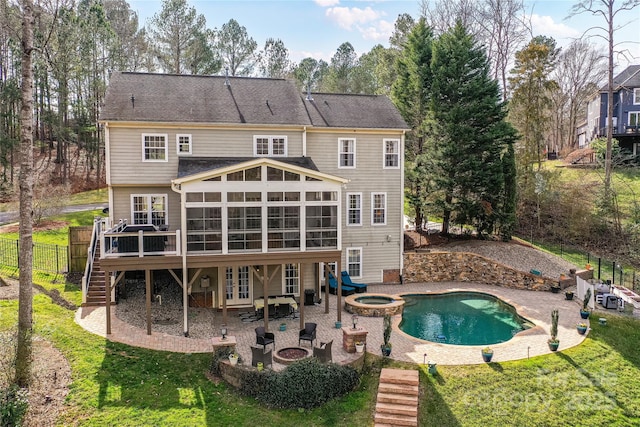 back of property with an outdoor fire pit, french doors, a patio area, and stairway