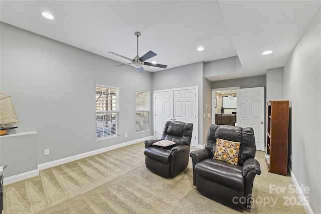 sitting room with ceiling fan, carpet floors, recessed lighting, and baseboards