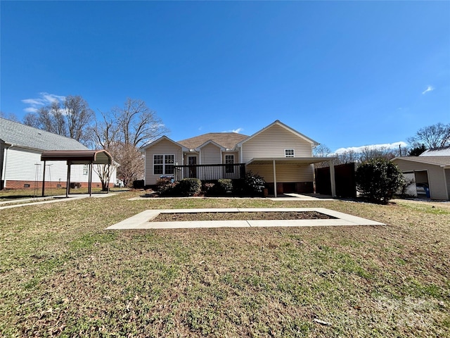 view of front of property with a carport and a front yard