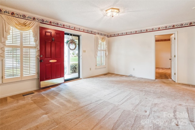 1007 Wentworth Dr, Kannapolis, NC 28081 - carpeted entrance foyer with visible vents and a textured ceiling