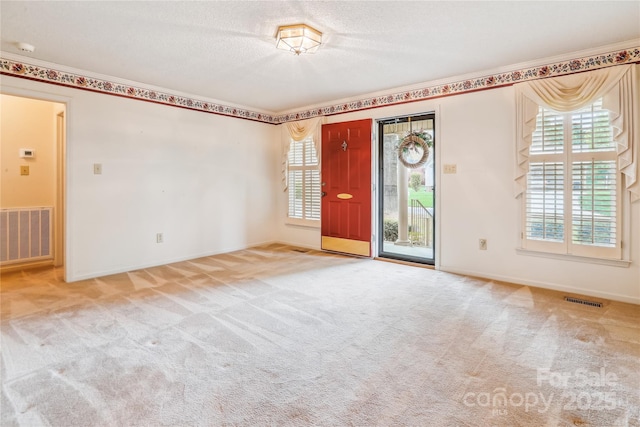 1007 Wentworth Dr, Kannapolis, NC 28081 - carpeted spare room featuring a textured ceiling, baseboards, and visible vents
