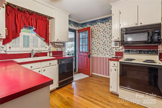 1007 Wentworth Dr, Kannapolis, NC 28081 - kitchen featuring a sink, ornamental molding, a textured ceiling, black appliances, and wallpapered walls