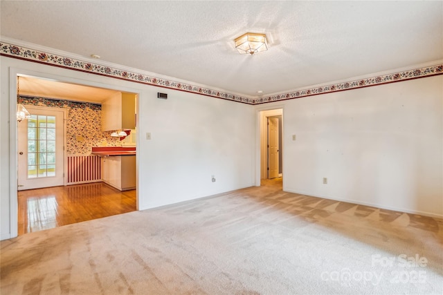 1007 Wentworth Dr, Kannapolis, NC 28081 - carpeted empty room with baseboards and a textured ceiling