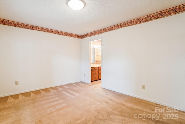 1007 Wentworth Dr, Kannapolis, NC 28081 - spare room with a textured ceiling, light colored carpet, and baseboards