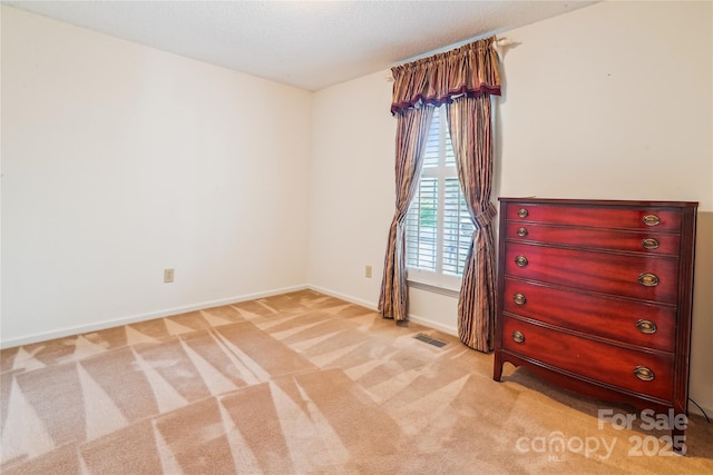1007 Wentworth Dr, Kannapolis, NC 28081 - unfurnished room with carpet, visible vents, and baseboards