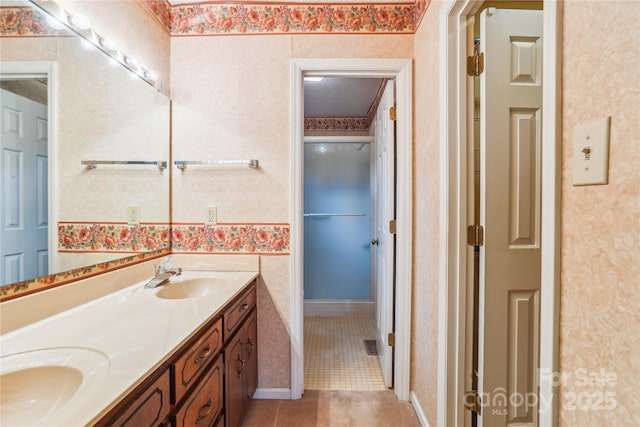 1007 Wentworth Dr, Kannapolis, NC 28081 - bathroom featuring a sink, double vanity, and wallpapered walls