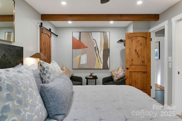 bedroom featuring a barn door, beamed ceiling, and recessed lighting