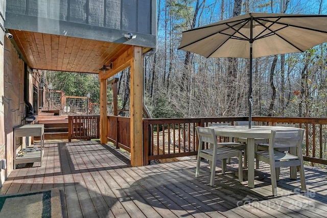 deck featuring outdoor dining area