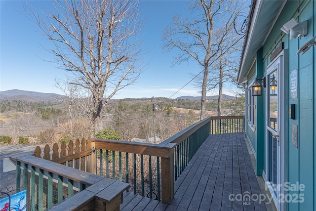 wooden terrace featuring a mountain view