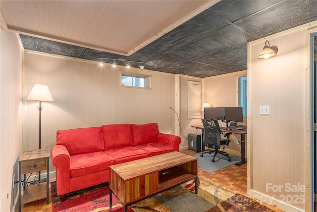 living area featuring wood walls