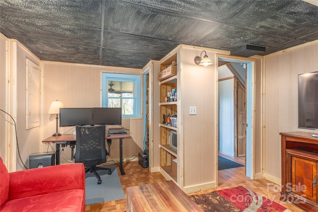 home office with wood walls