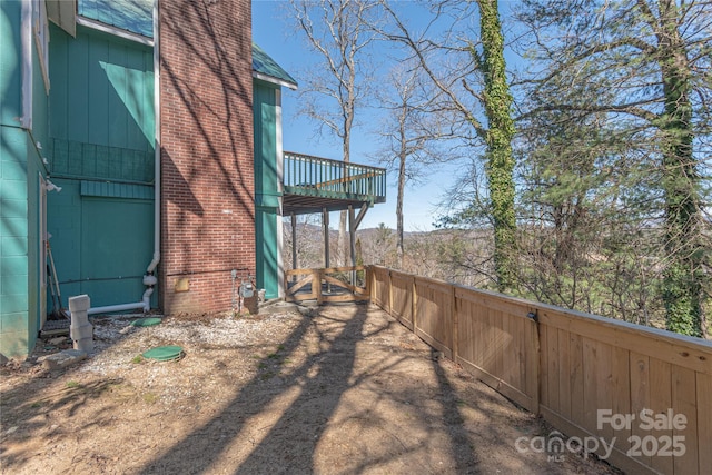 view of yard with a wooden deck