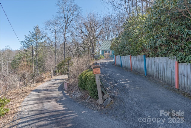 view of road featuring aphalt driveway