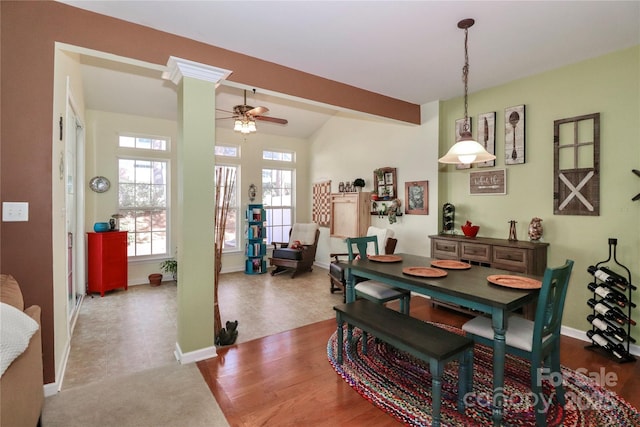 dining room with beam ceiling, decorative columns, baseboards, and ceiling fan