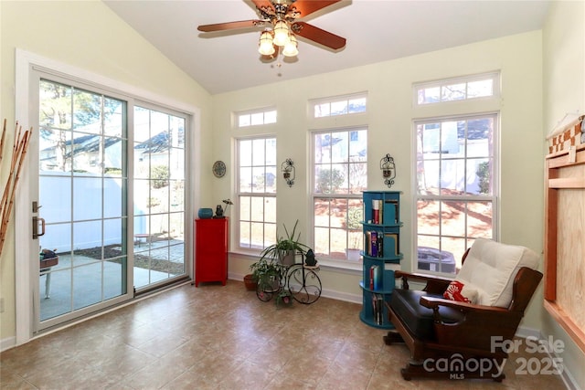 interior space with vaulted ceiling and ceiling fan