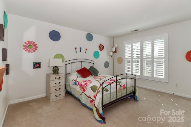 bedroom with carpet, visible vents, and baseboards