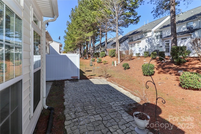 exterior space with fence and a residential view