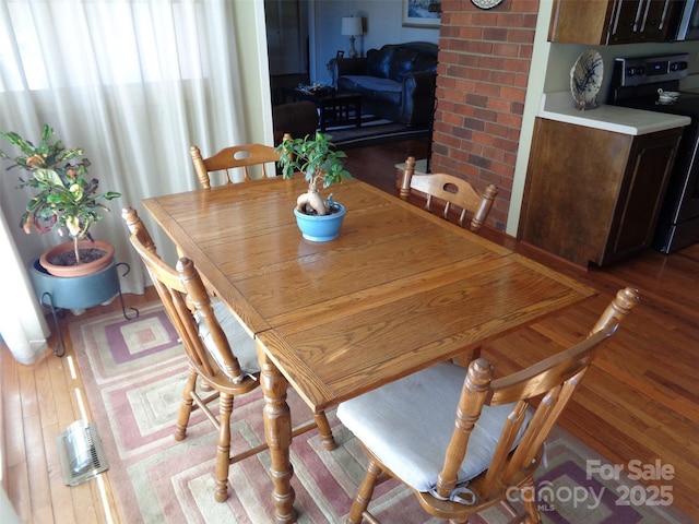 dining room with wood finished floors