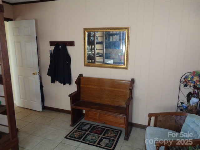 living area with light tile patterned floors and baseboards