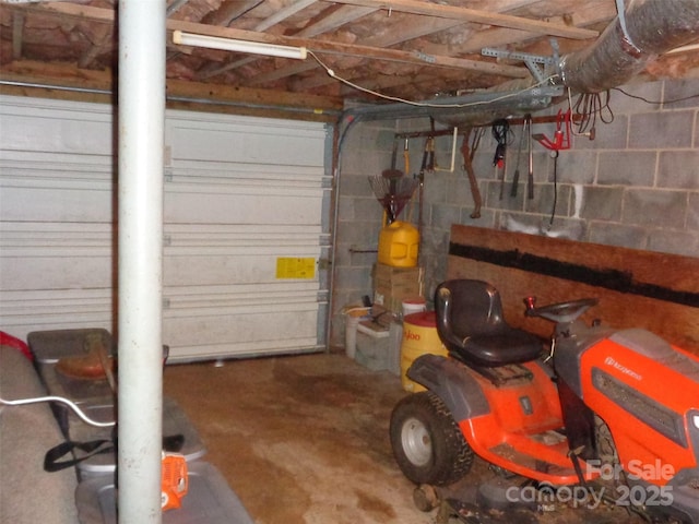 garage with concrete block wall