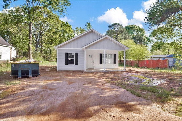 265 Duke Dr, Salisbury, NC 28146 - view of front facade featuring driveway, fence, and covered porch