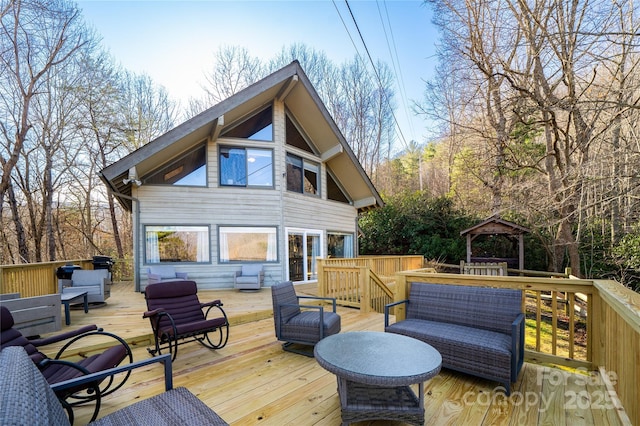 deck featuring an outdoor living space and a gazebo