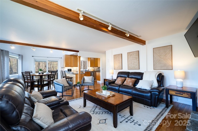 living room featuring light wood-type flooring and beam ceiling