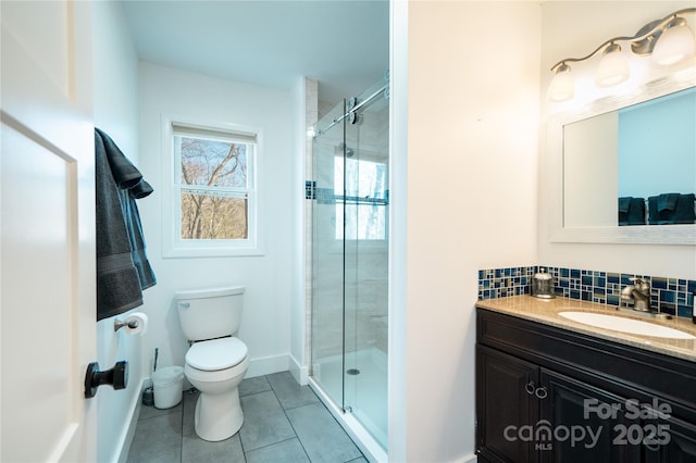 full bathroom with backsplash, toilet, a stall shower, vanity, and tile patterned flooring