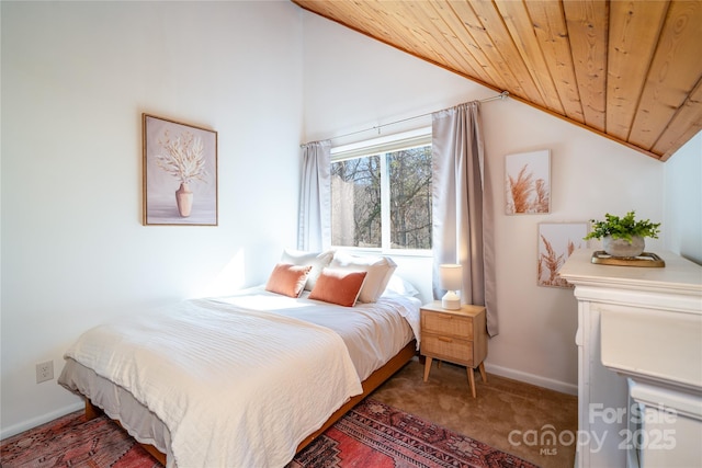 bedroom with wooden ceiling, baseboards, dark carpet, and vaulted ceiling