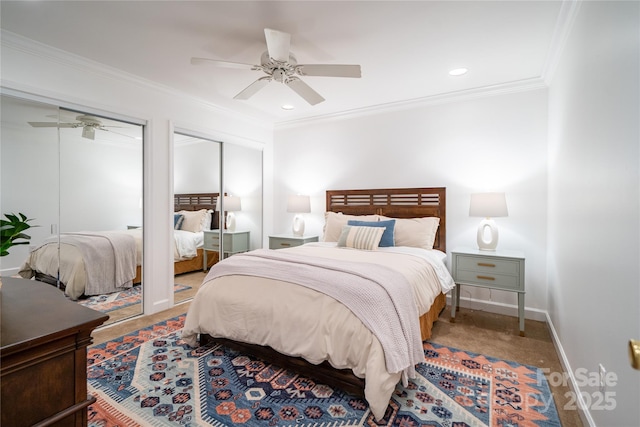 bedroom with baseboards, a ceiling fan, ornamental molding, two closets, and recessed lighting