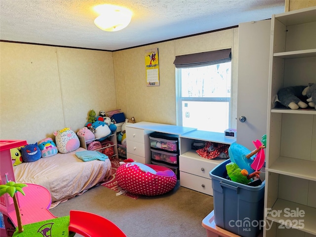 carpeted bedroom featuring crown molding and a textured ceiling