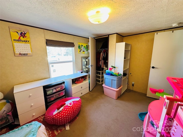 playroom with a textured ceiling and light colored carpet