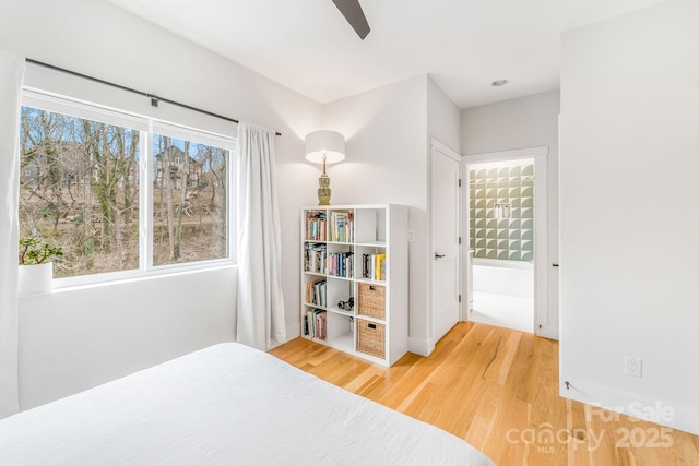 bedroom with wood finished floors and a ceiling fan