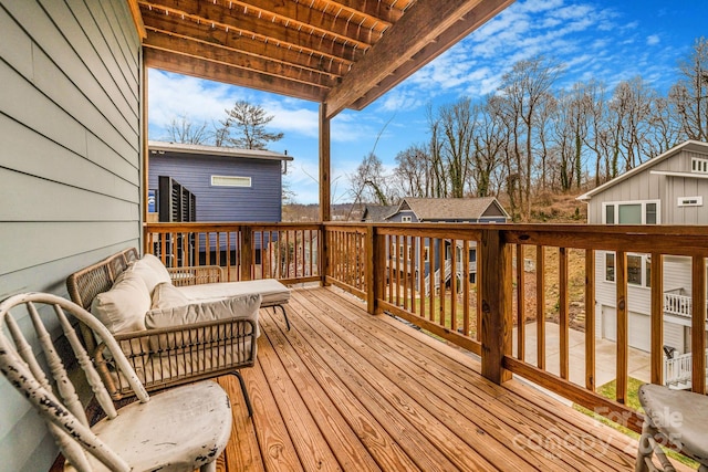 wooden terrace featuring an outdoor hangout area