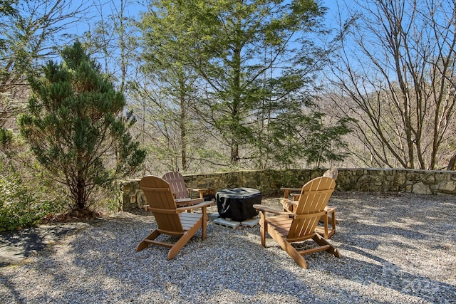 view of patio featuring an outdoor fire pit